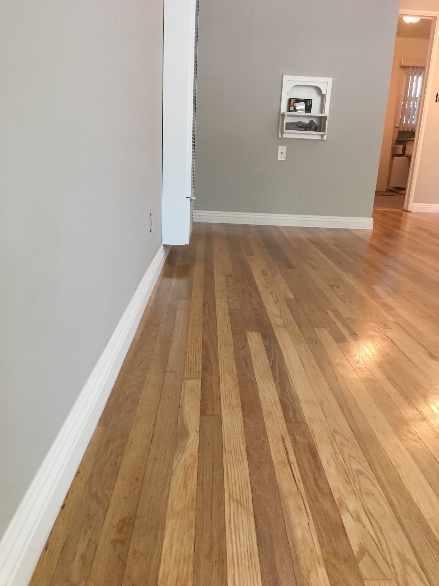 Oak Hardwood Floor Sanding and Refinish plus Baseboard Installation by Leo's Flooring.