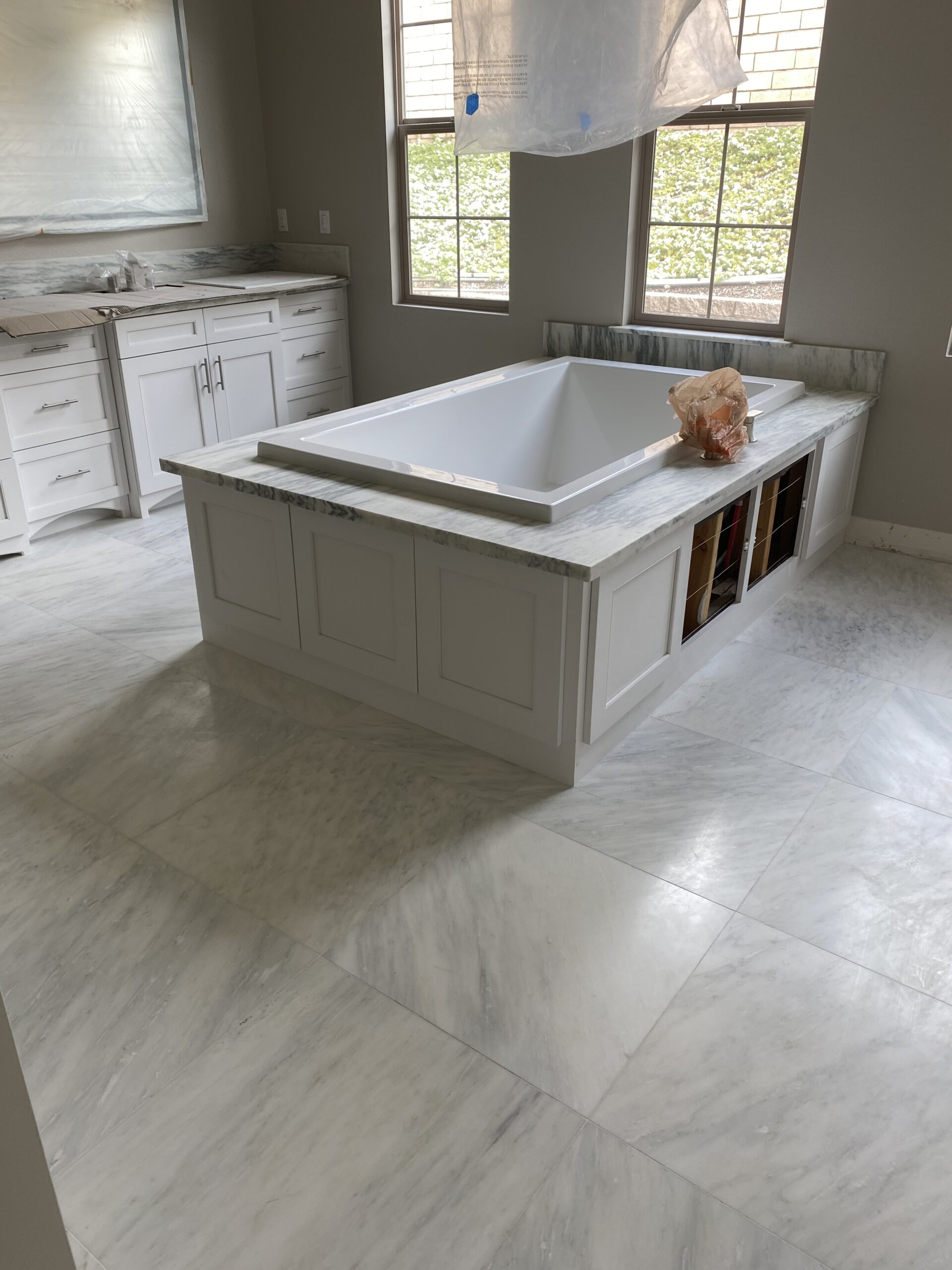 White Tile Installation in bathroom.