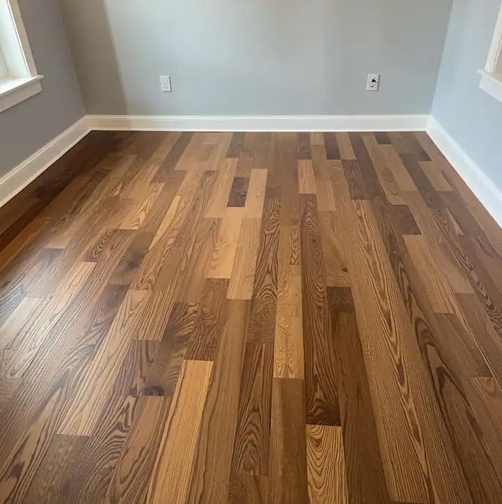 Laminate flooring installation in residential hallway.